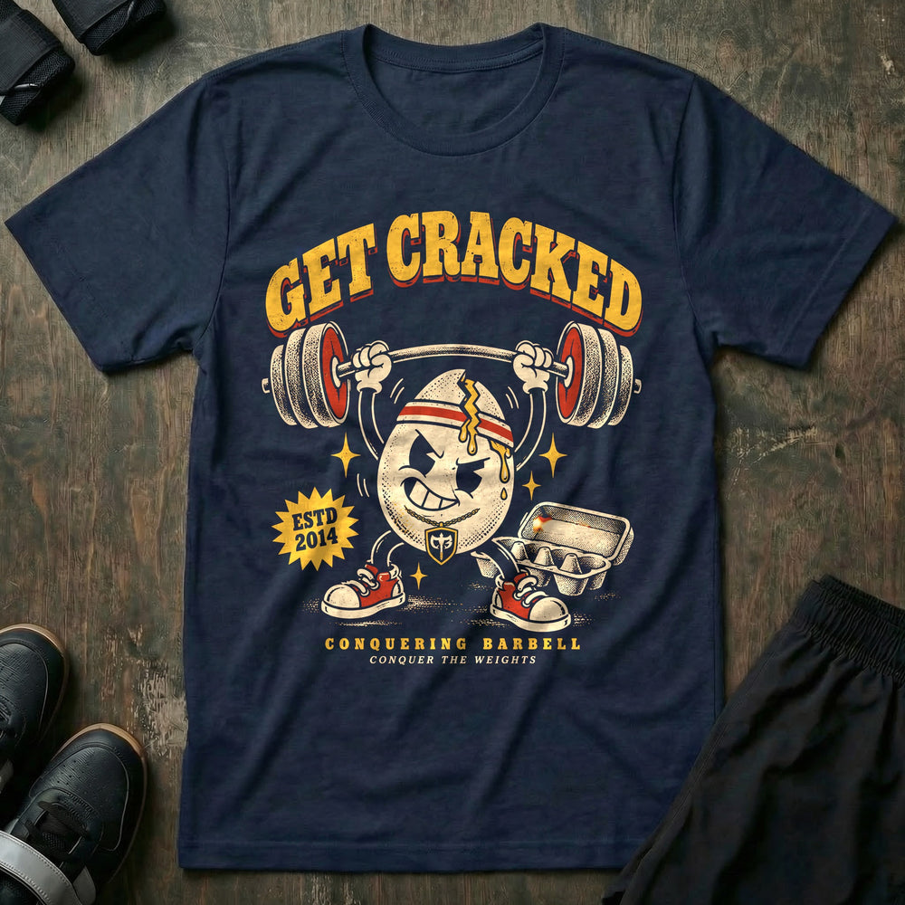 Get Cracked - Tee front graphic in Navy with a cracked egg mascot in a headband pressing a barbell overhead - Conquering Barbell
