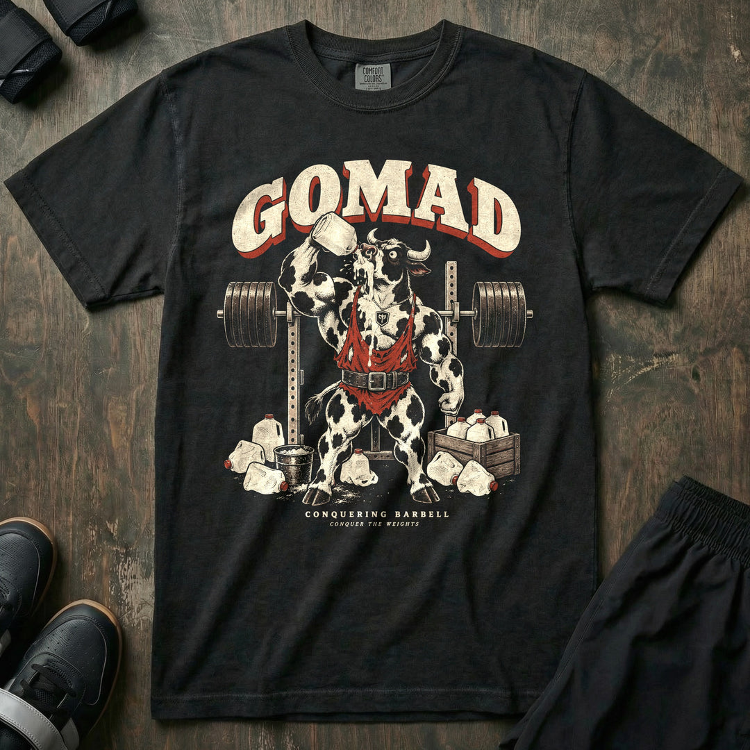 GOMAD - Relaxed Fit Tee front graphic in Black with a Holstein bull in a singlet chugging a gallon of milk at the squat rack - Conquering Barbell