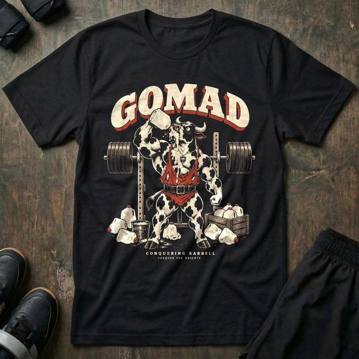 GOMAD - Tee front graphic in Black with a Holstein bull in a singlet chugging a gallon of milk at the squat rack - Conquering Barbell