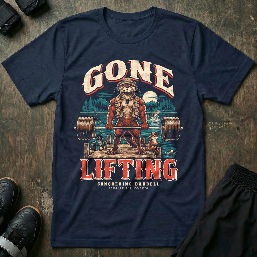 Gone Lifting - Tee front graphic in Navy with an otter dad in a bucket hat and fishing vest deadlifting a loaded barbell on a lake dock while a young otter fishes - Conquering Barbell