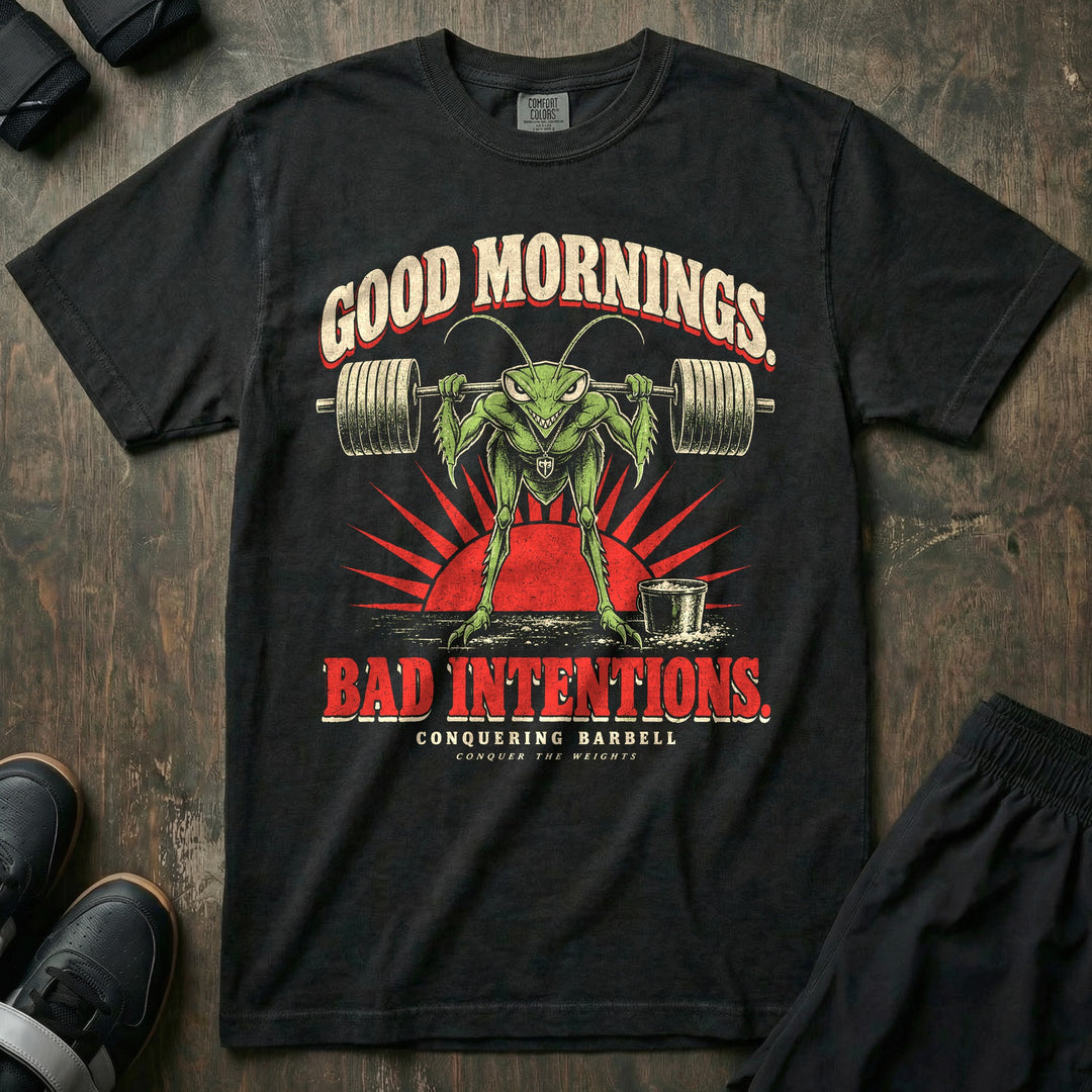 Good Mornings Bad Intentions - Relaxed Fit Tee front graphic in Black with a praying mantis doing good mornings with a loaded barbell against a red sunrise - Conquering Barbell