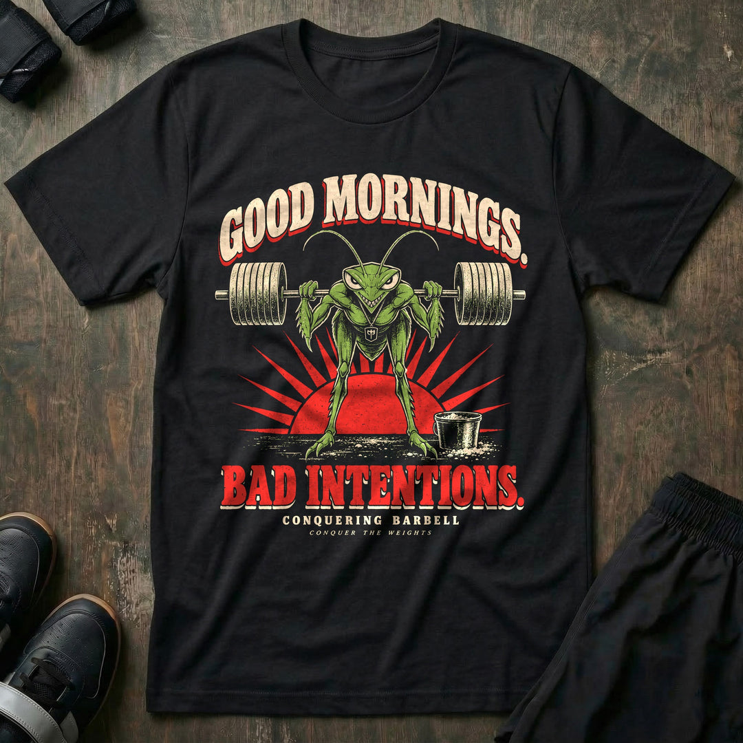 Good Mornings Bad Intentions - Tee front graphic in Black with a praying mantis hinged forward under a loaded barbell against a red sunrise - Conquering Barbell