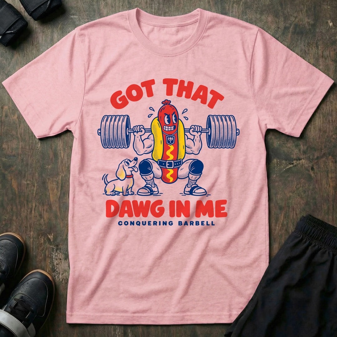 Got That Dawg in Me - Tee front graphic in Pink with a hot dog in a bun back squatting a loaded barbell while a dachshund watches - Conquering Barbell