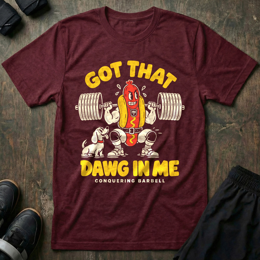 Got That Dawg in Me - Tee front graphic in Maroon with a hot dog in a bun back squatting a loaded barbell while a dachshund watches - Conquering Barbell