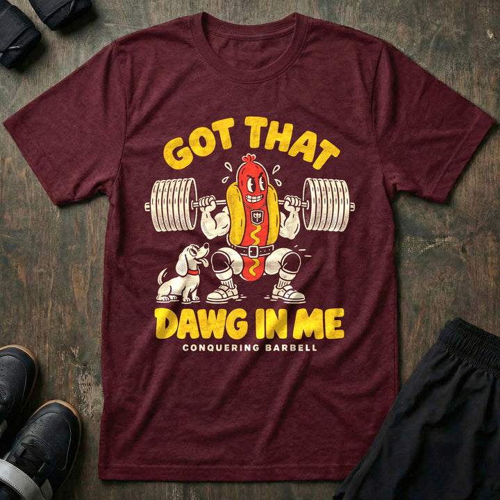 Got That Dawg in Me - Tee front graphic in Maroon with a hot dog in a bun back squatting a loaded barbell while a dachshund watches - Conquering Barbell