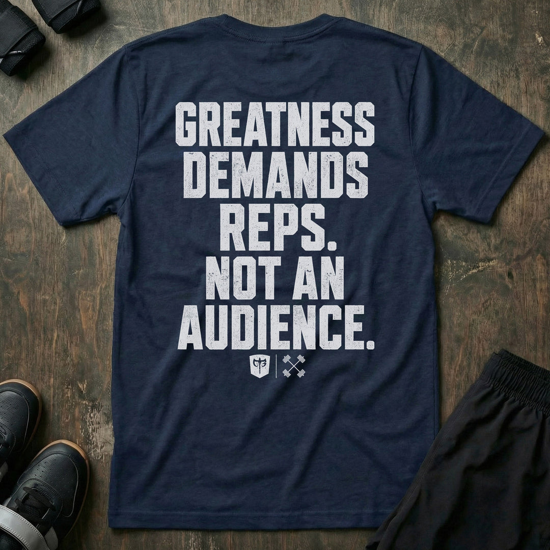 Greatness Demands Reps. Not an Audience. tee in Navy: the full statement in oversized distressed block lettering stacked down