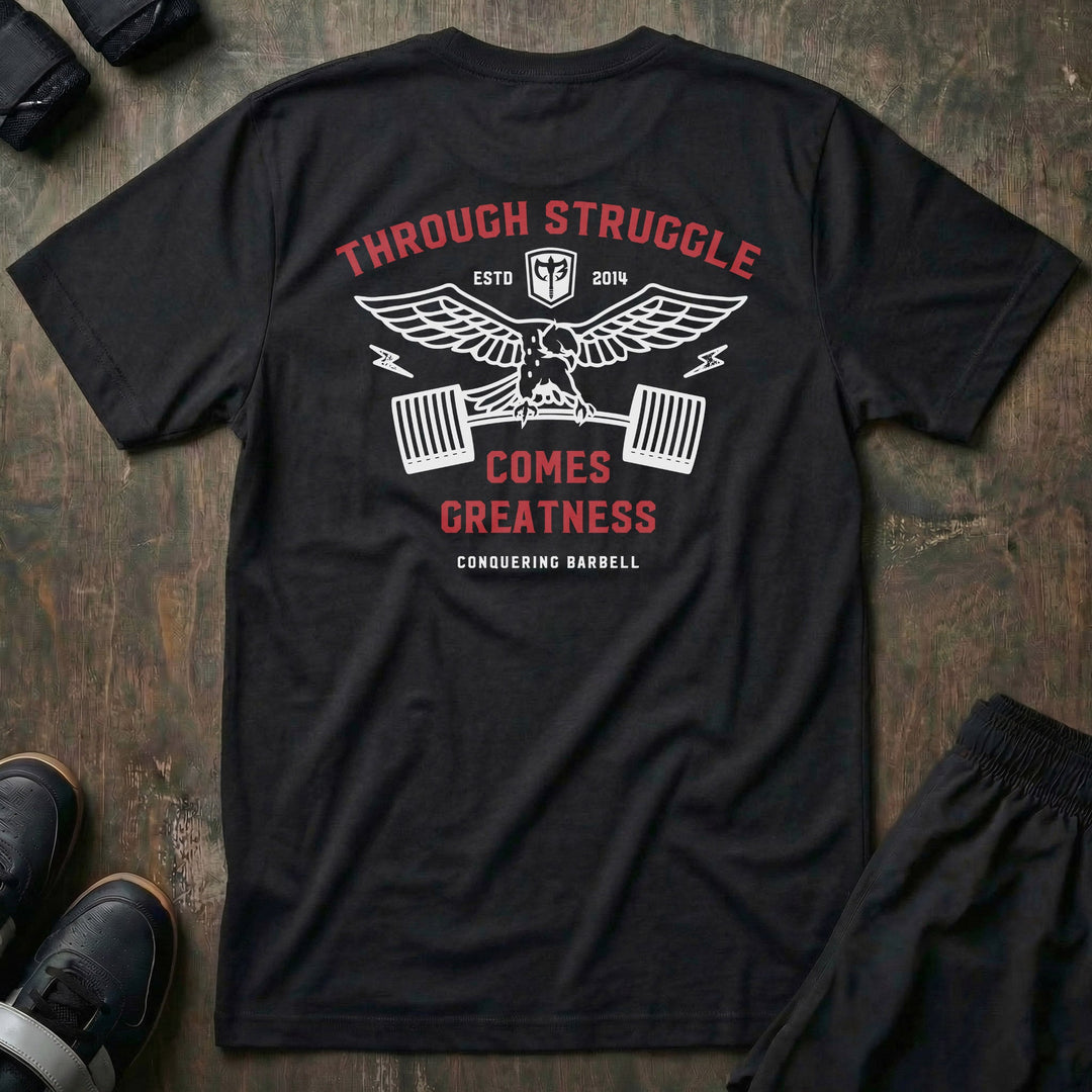 Greatness Eagle tee in Black: a spread-wing eagle gripping a loaded barbell with lightning bolts on each side