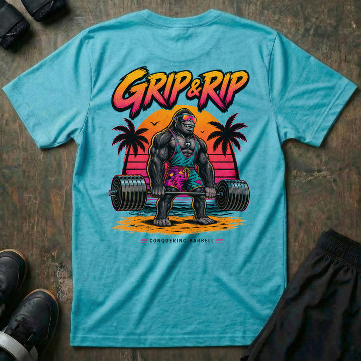 Grip &amp; Rip tee in Tahiti: a jacked gorilla in board shorts and sport shades deadlifting a loaded barbell