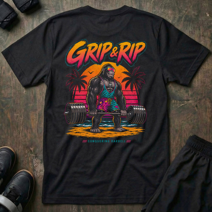 Grip &amp; Rip tee: a jacked gorilla in board shorts and sport shades deadlifting a loaded barbell on a neon sunset beach