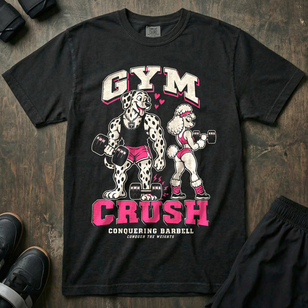 Gym Crush - Relaxed Fit Tee front graphic in Black with a lovestruck Dalmatian dropping a dumbbell on his foot while staring at a poodle - Conquering Barbell