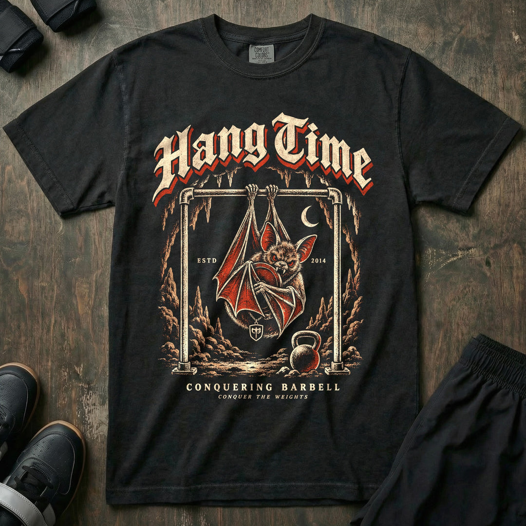 Hang Time - Relaxed Fit Tee front graphic in Black with a bat hanging upside down from a pull-up bar in a cave - Conquering Barbell