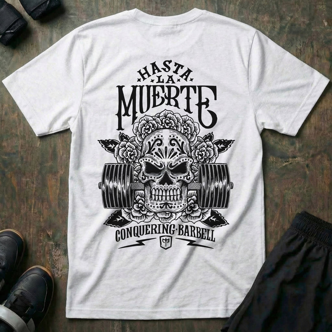Hasta La Muerte (Until Death) Original Version tee in White: a sugar skull crowned with roses over a loaded barbell