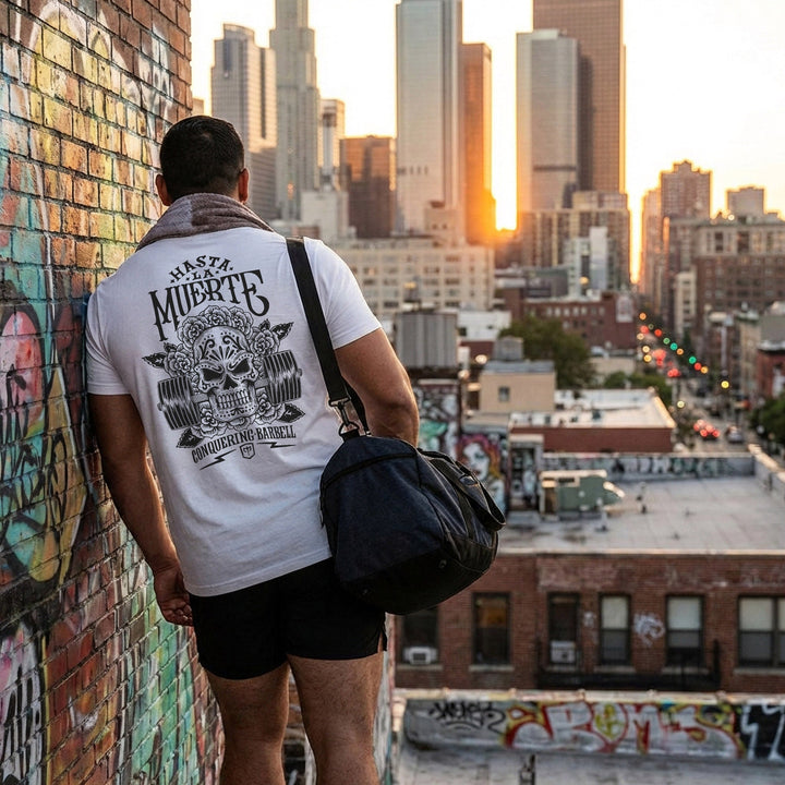Hasta La Muerte (Until Death) Original Version tee: a sugar skull crowned with roses over a loaded barbell