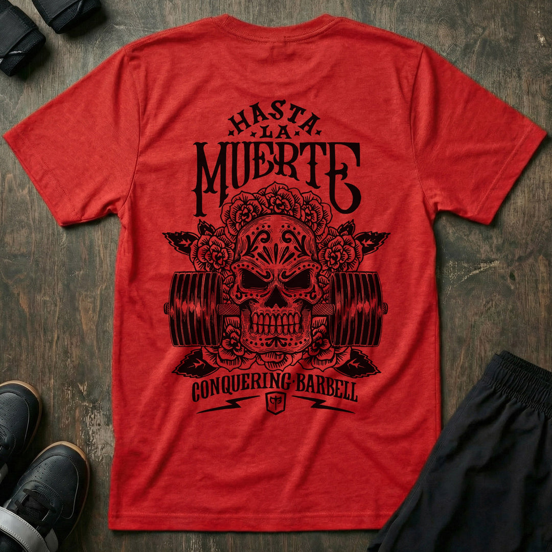 Hasta La Muerte (Until Death) Original Version tee in Red: a sugar skull crowned with roses over a loaded barbell