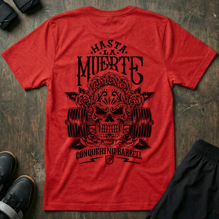 Hasta La Muerte (Until Death) Original Version tee in Red: a sugar skull crowned with roses over a loaded barbell