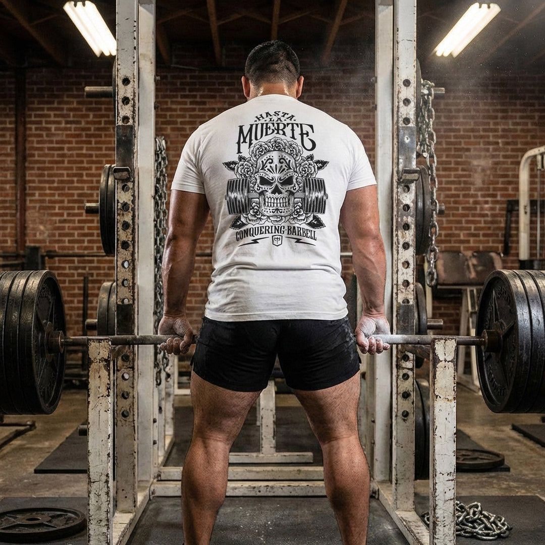 Hasta La Muerte (Until Death) Original Version tee: a sugar skull crowned with roses over a loaded barbell