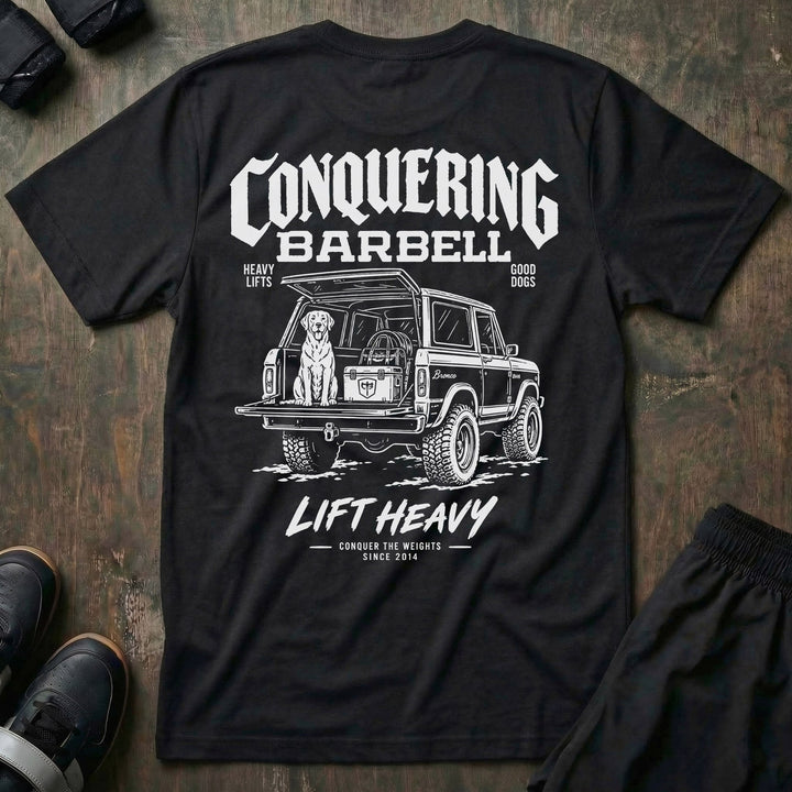 Heavy Lifts, Good Dogs tee in Black: a classic SUV with the tailgate down and a good lab sitting patiently in the back