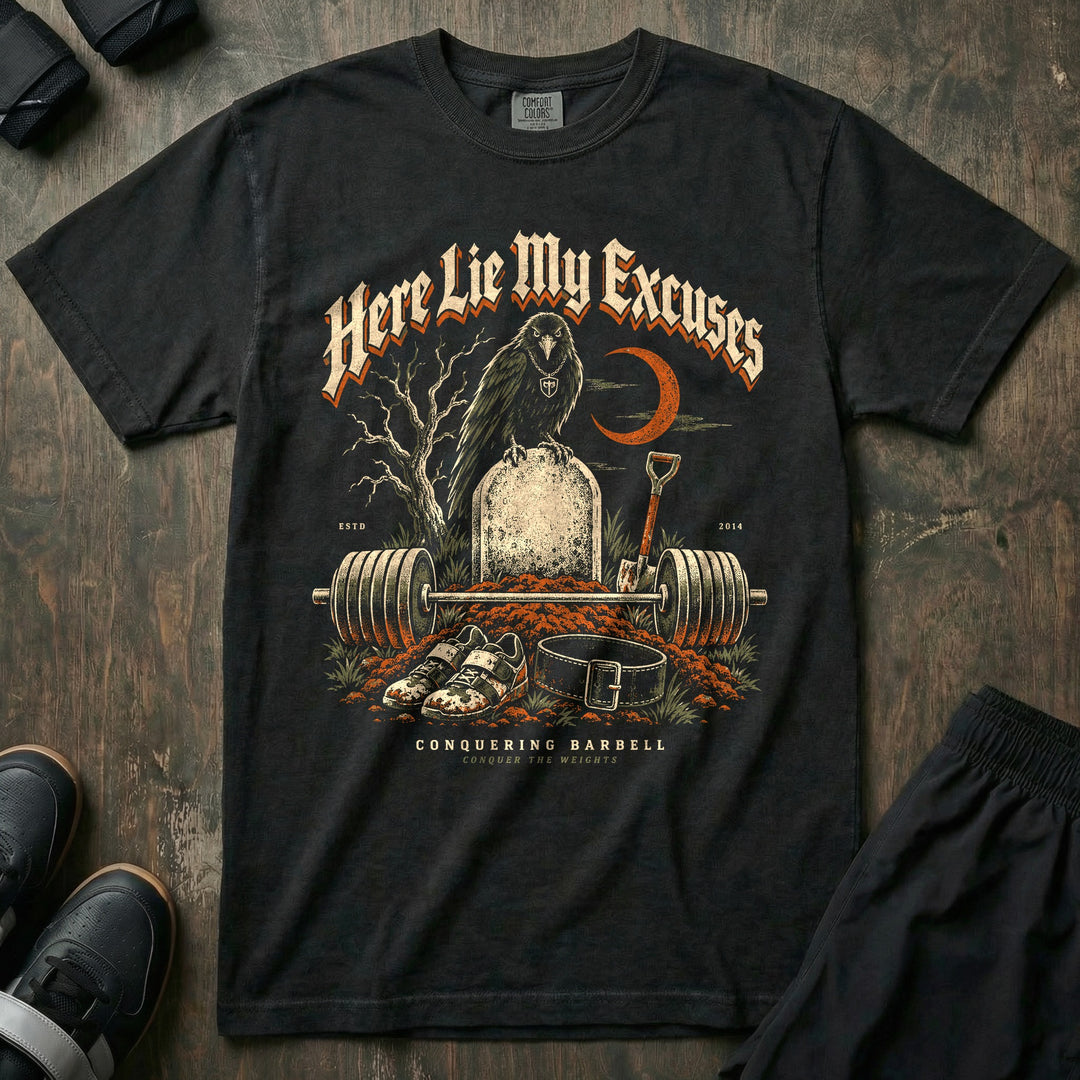 Here Lie My Excuses - Relaxed Fit Tee front graphic in Black with a raven on a headstone over a fresh grave with a loaded barbell - Conquering Barbell