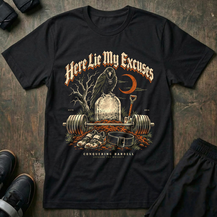 Here Lie My Excuses - Tee front graphic in Black with a raven on a headstone over a fresh grave with a loaded barbell - Conquering Barbell