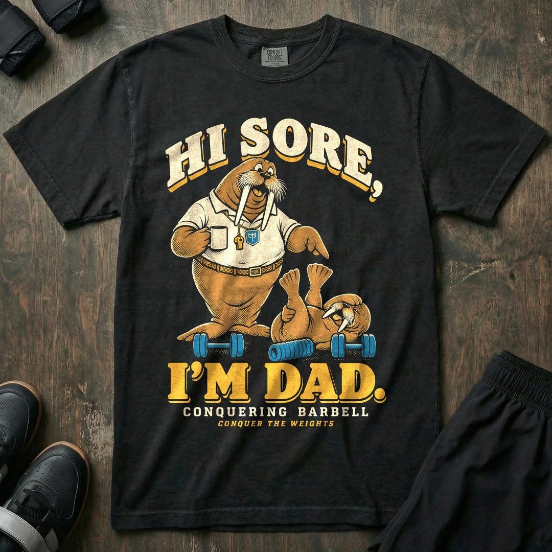 Hi Sore, I'm Dad - Relaxed Fit Tee front graphic in Black with a walrus dad holding a coffee mug and pointing at a young walrus lying on its back between dumbbells - Conquering Barbell