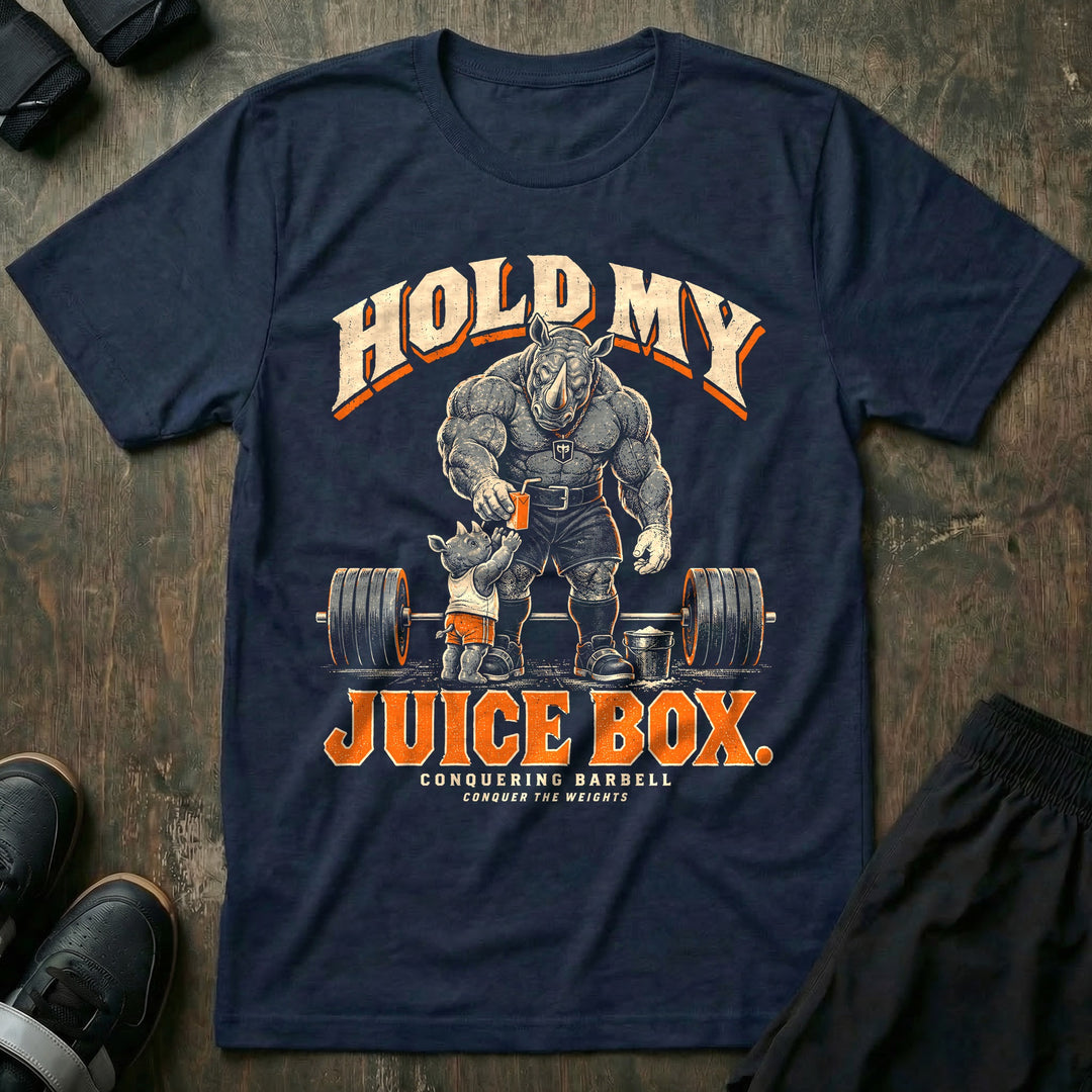 Hold My Juice Box - Tee front graphic in Navy with a muscular rhino dad handing a juice box to a young rhino in front of a loaded barbell and a chalk bucket - Conquering Barbell