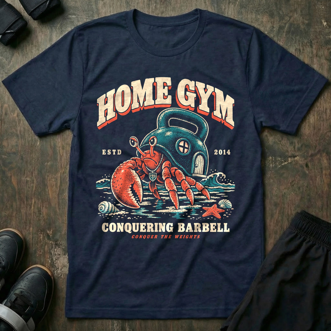 Home Gym - Tee front graphic in Navy with a hermit crab living inside a kettlebell on the beach - Conquering Barbell