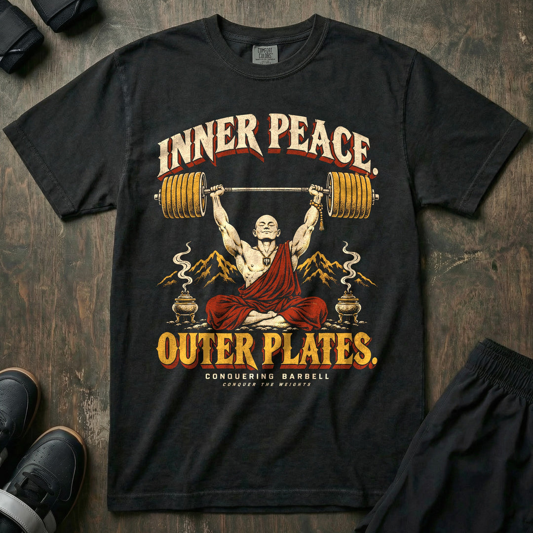 Inner Peace Outer Plates - Relaxed Fit Tee front graphic in Black with a meditating monk in a red robe pressing a loaded barbell overhead - Conquering Barbell