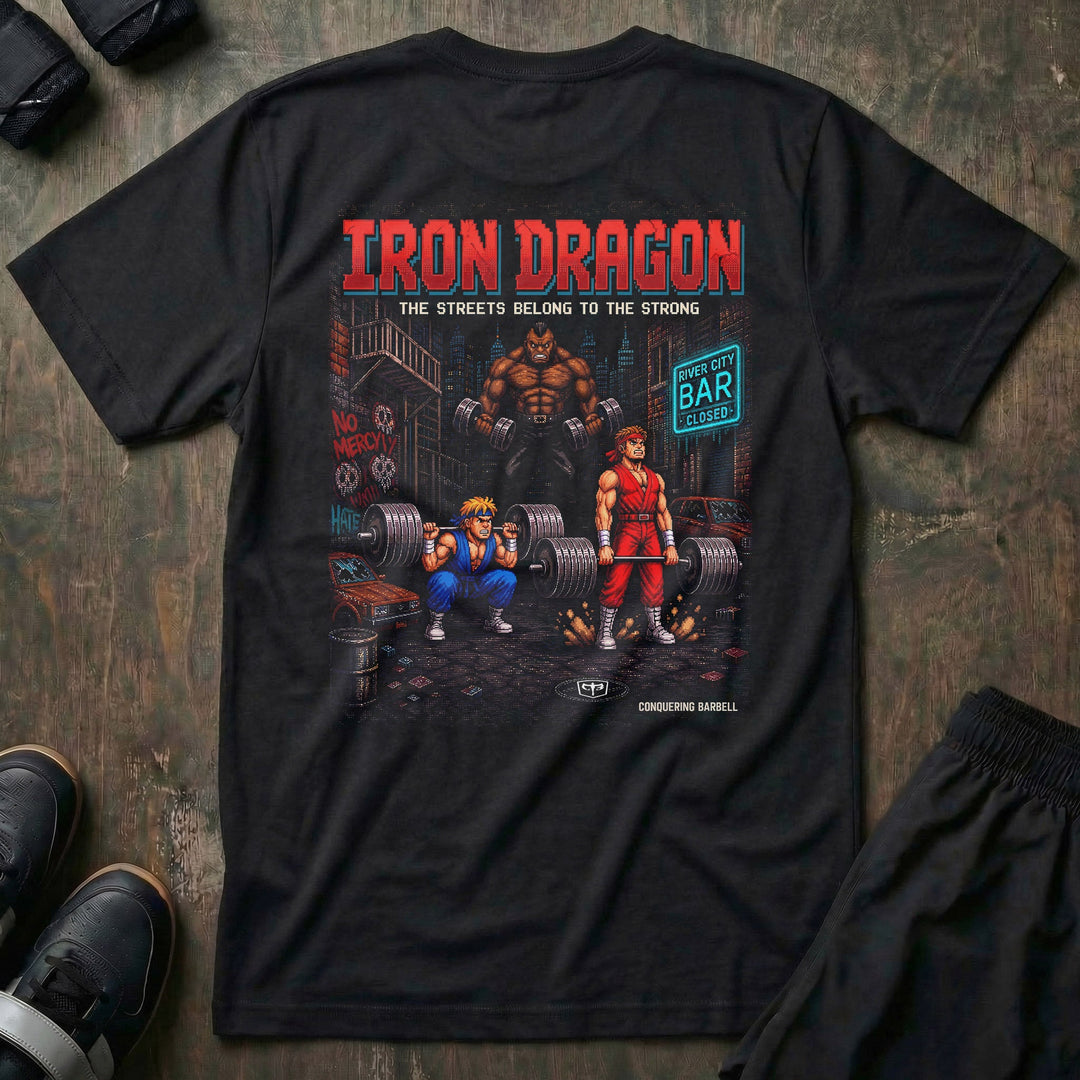 Iron Dragon tee in Black: a pixel-art street scene with two fighters squatting and deadlifting loaded barbells