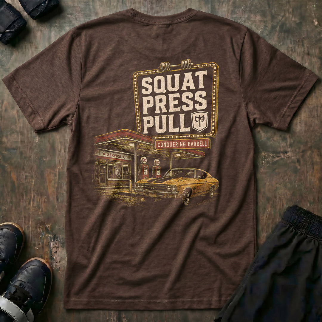 Iron Station tee in Expresso: a vintage marquee sign framed in bulb lights reading SQUAT PRESS PULL