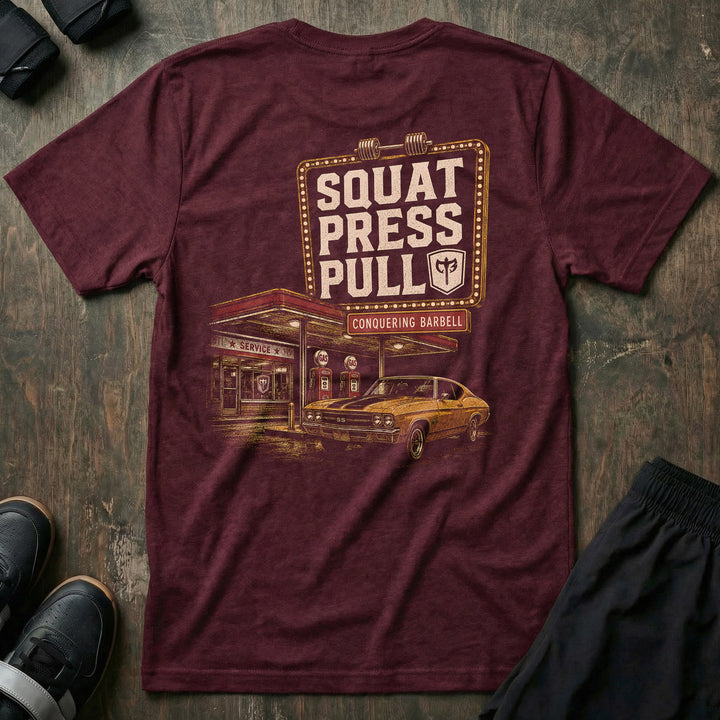 Iron Station tee in Maroon: a vintage marquee sign framed in bulb lights reading SQUAT PRESS PULL