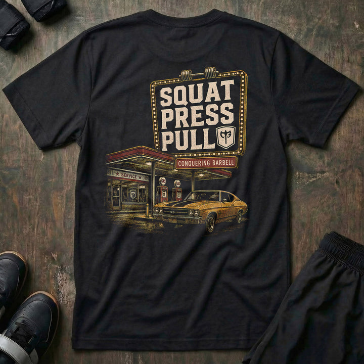 Iron Station tee in Black: a vintage marquee sign framed in bulb lights reading SQUAT PRESS PULL