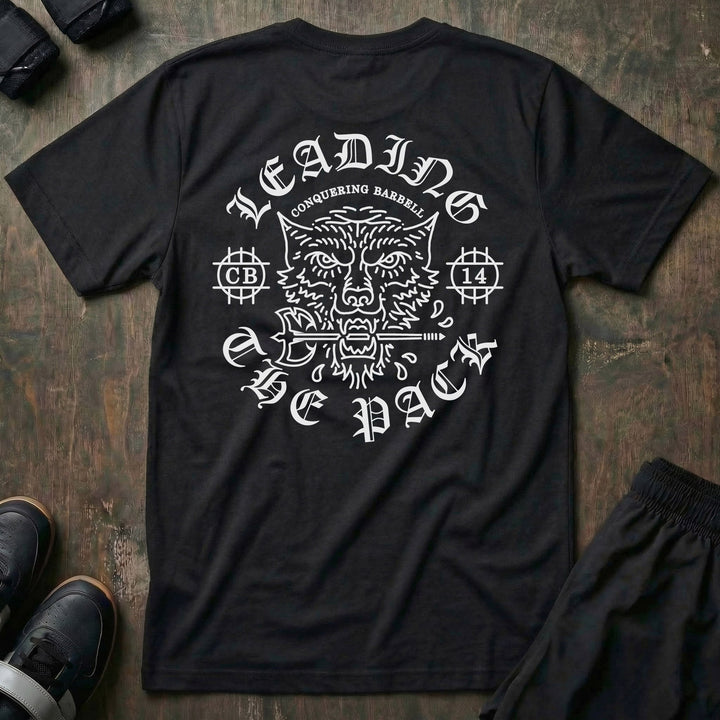 Leading The Pack tee in Black: a snarling wolf gripping a barbell in its jaws
