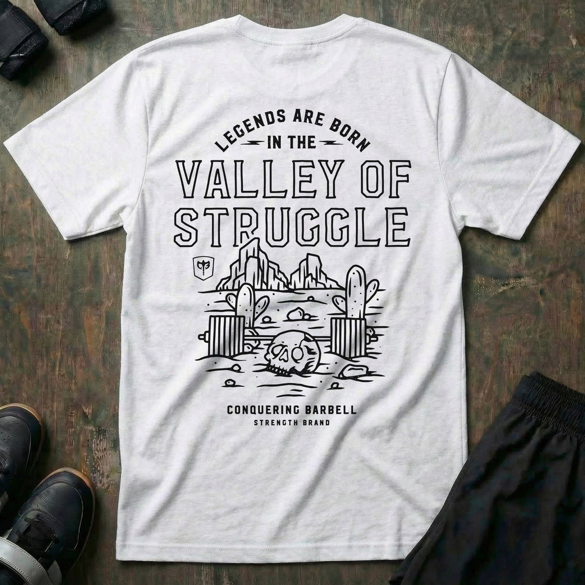 Legends are born in the Valley of Struggle tee in White: a desert valley scene with rock towers and cacti