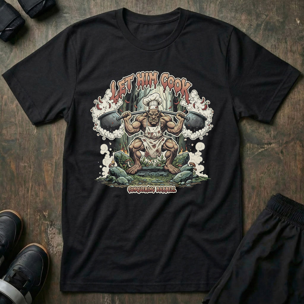 Let Him Cook! Troll Squat tee in Black: a jacked troll in a chef hat dropping into a deep squat