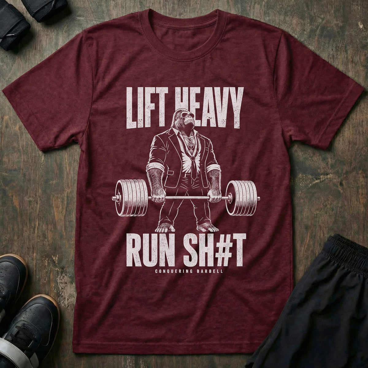 Lift Heavy, Run Sh#t tee in Maroon: a jacked gorilla in a tailored suit deadlifting a loaded barbell