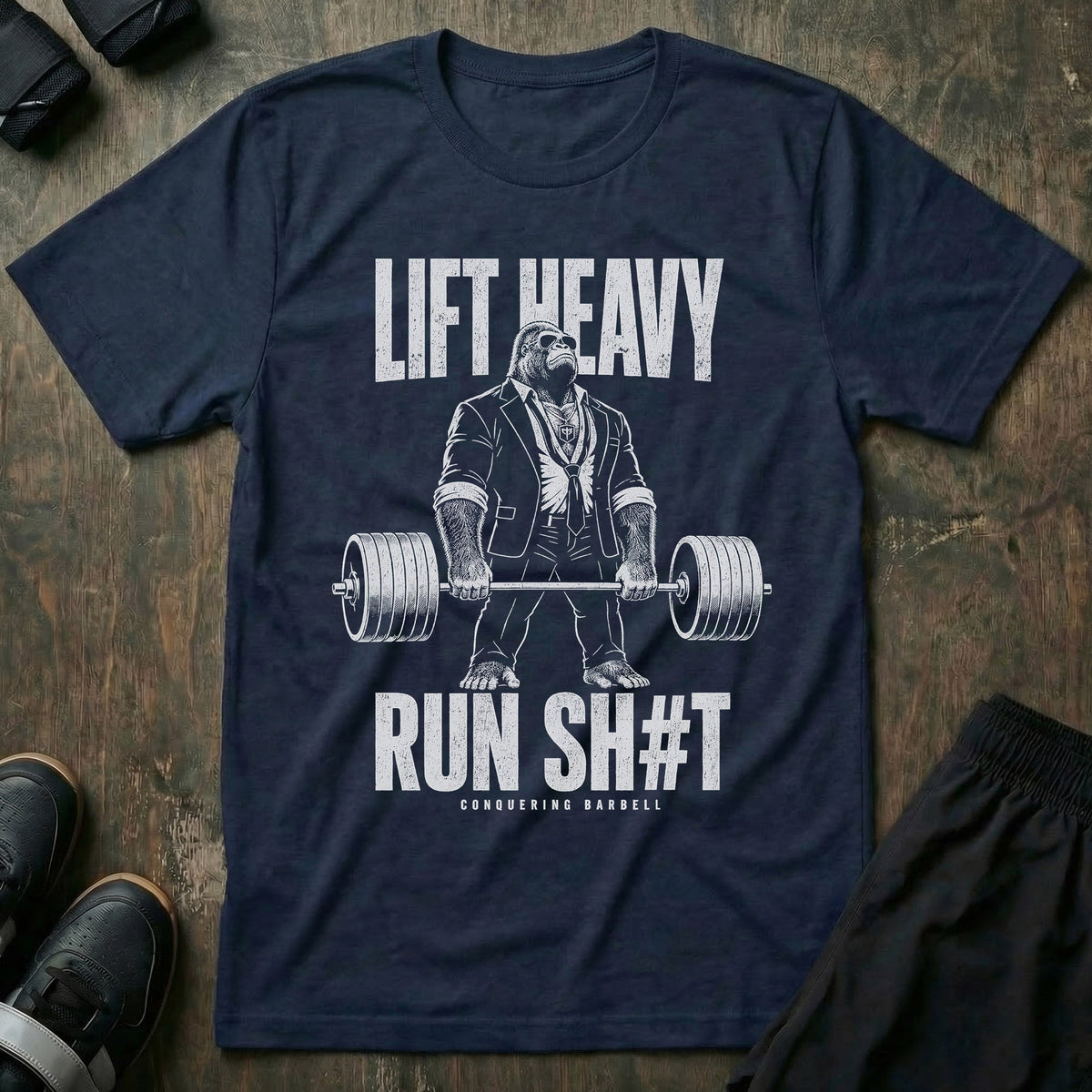 Lift Heavy, Run Sh#t tee in Navy: a jacked gorilla in a tailored suit deadlifting a loaded barbell