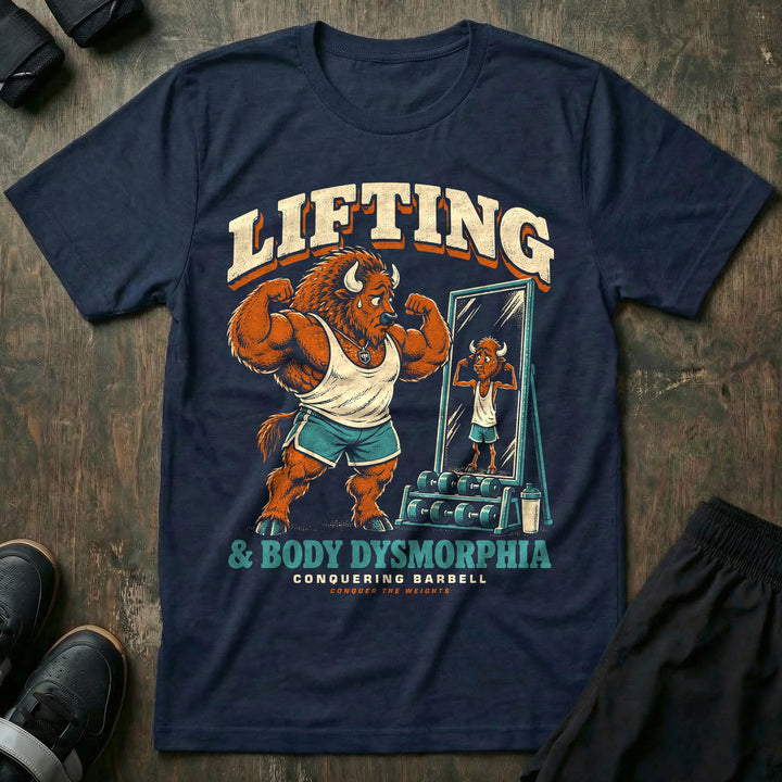 Lifting and Body Dysmorphia - Tee front graphic in Navy with a huge bison flexing in a mirror that shows a scrawny reflection - Conquering Barbell