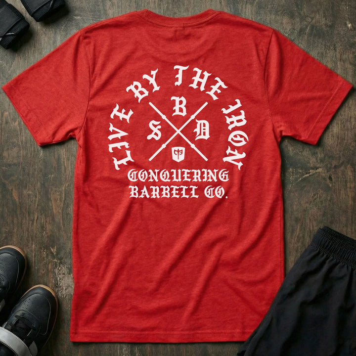 Live by the Iron tee in Red: a circular old English LIVE BY THE IRON design built around two crossed barbell sleeves