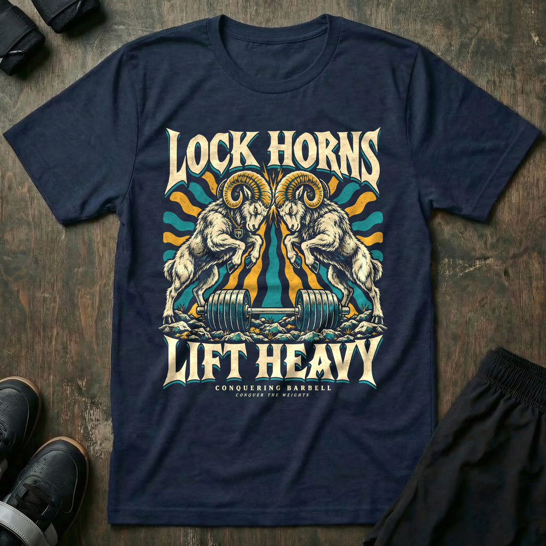 Lock Horns Lift Heavy - Tee front graphic in Navy with two bighorn rams locking horns over a loaded barbell - Conquering Barbell
