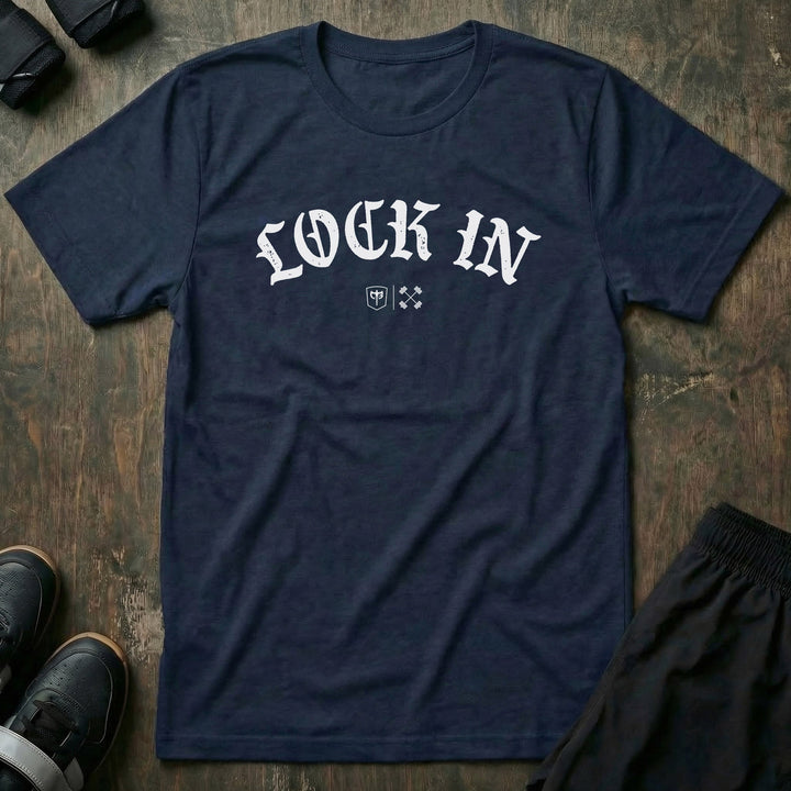 Lock In tee in Navy: LOCK IN in bold old English lettering arched across the front with the CB marks below