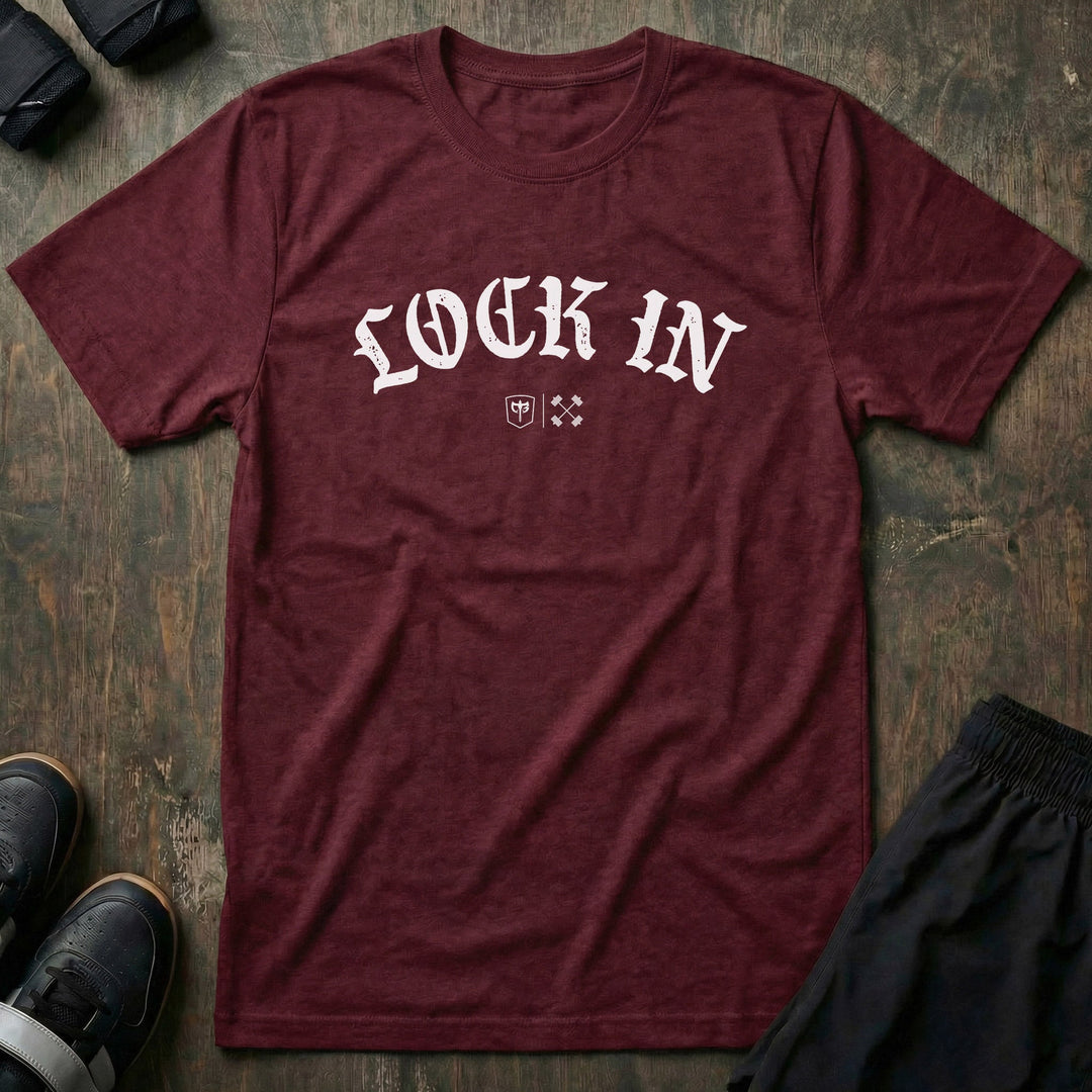 Lock In tee in Maroon: LOCK IN in bold old English lettering arched across the front with the CB marks below