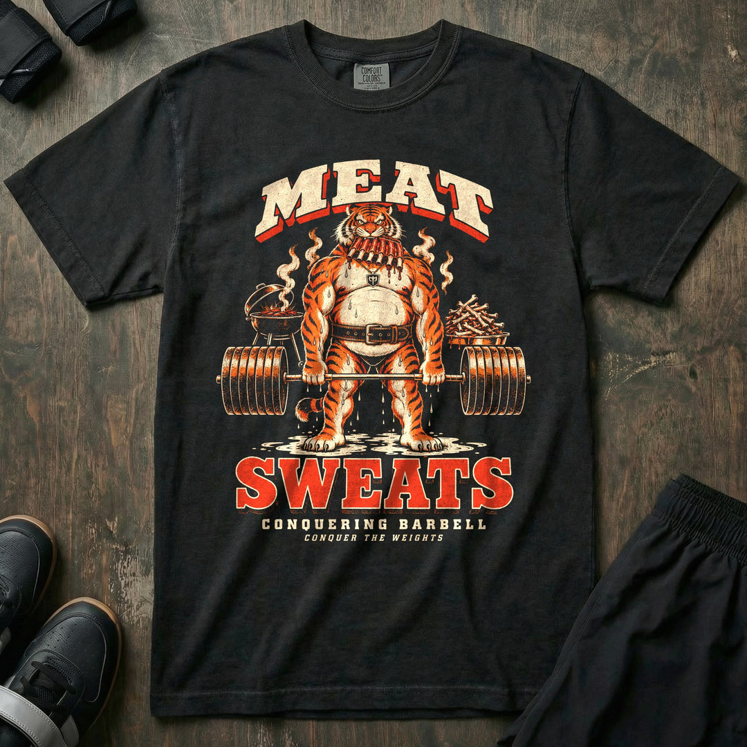 Meat Sweats - Relaxed Fit Tee front graphic in Black with a sweating tiger holding a rack of ribs in its jaws at deadlift lockout beside a grill - Conquering Barbell