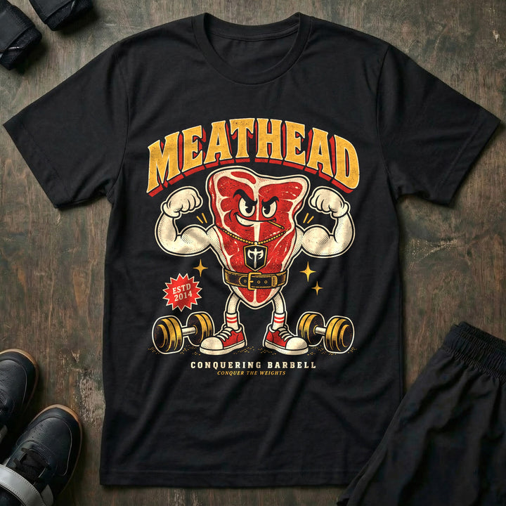 Meathead - Tee front graphic in Black with a T-bone steak mascot flexing both arms in a lifting belt - Conquering Barbell