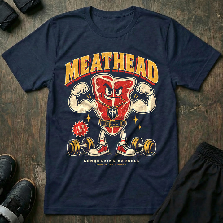 Meathead - Tee front graphic in Navy with a T-bone steak mascot flexing both arms in a lifting belt - Conquering Barbell