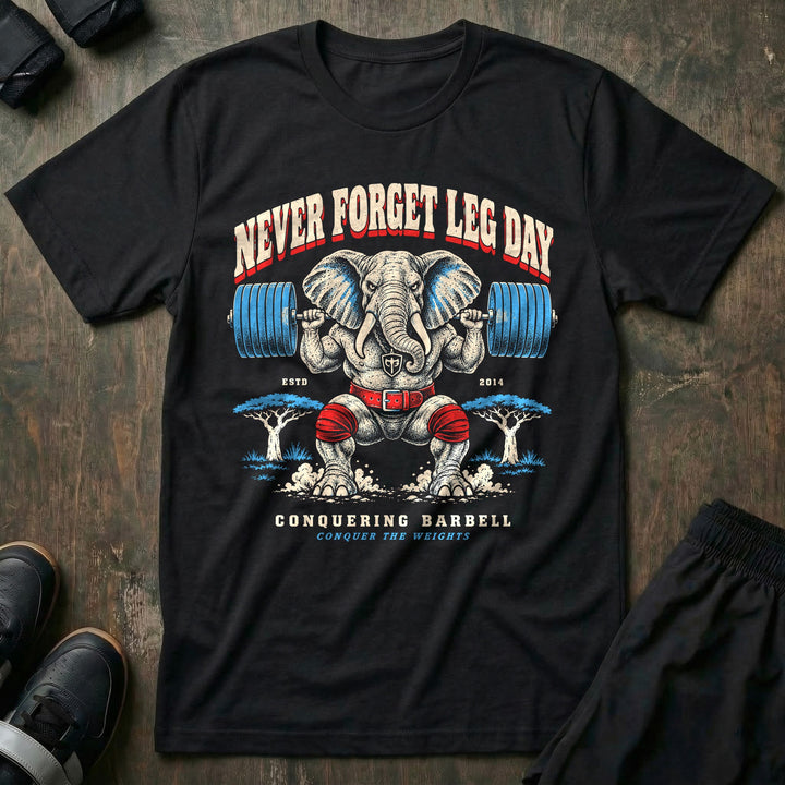 Never Forget Leg Day - Tee front graphic in Black with an elephant in red knee wraps in a deep barbell squat - Conquering Barbell