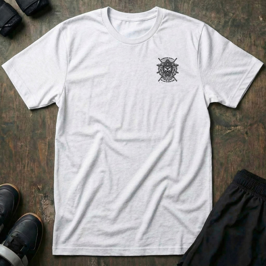 No Lion is Born King tee: a roaring lion in front of crossed barbells