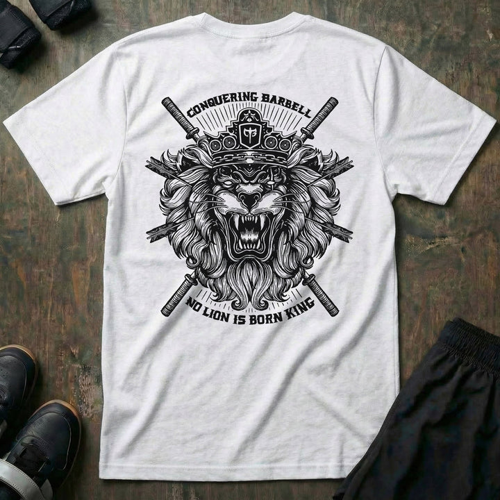 No Lion is Born King tee in White: a roaring lion in front of crossed barbells