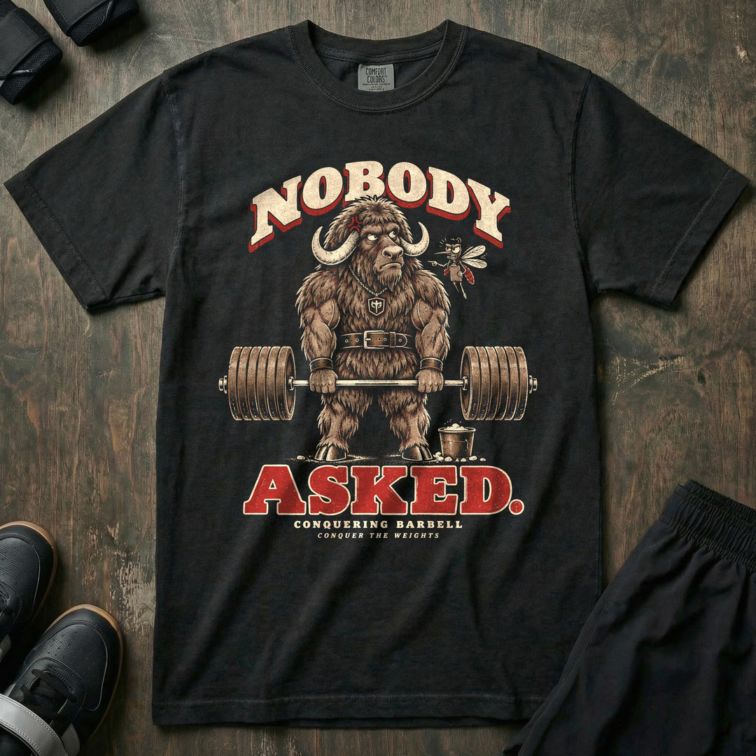 Nobody Asked - Relaxed Fit Tee front graphic in Black with a musk ox at deadlift lockout while a mosquito lectures in his ear - Conquering Barbell
