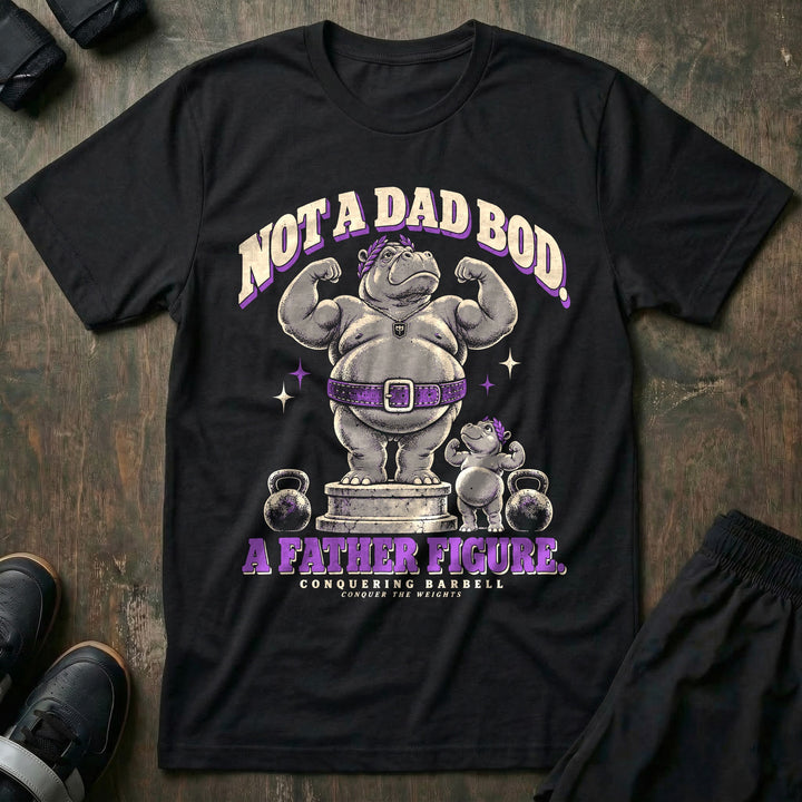 Not a Dad Bod. A Father Figure - Tee front graphic in Black with a hippo in a laurel wreath and purple lifting belt flexing on a marble pedestal beside a small hippo copying the pose - Conquering Barbell