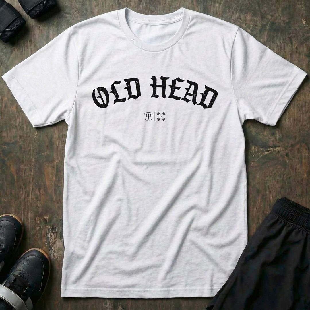 Old Head tee in White: OLD HEAD in bold old English lettering arched across the chest with small CB marks below